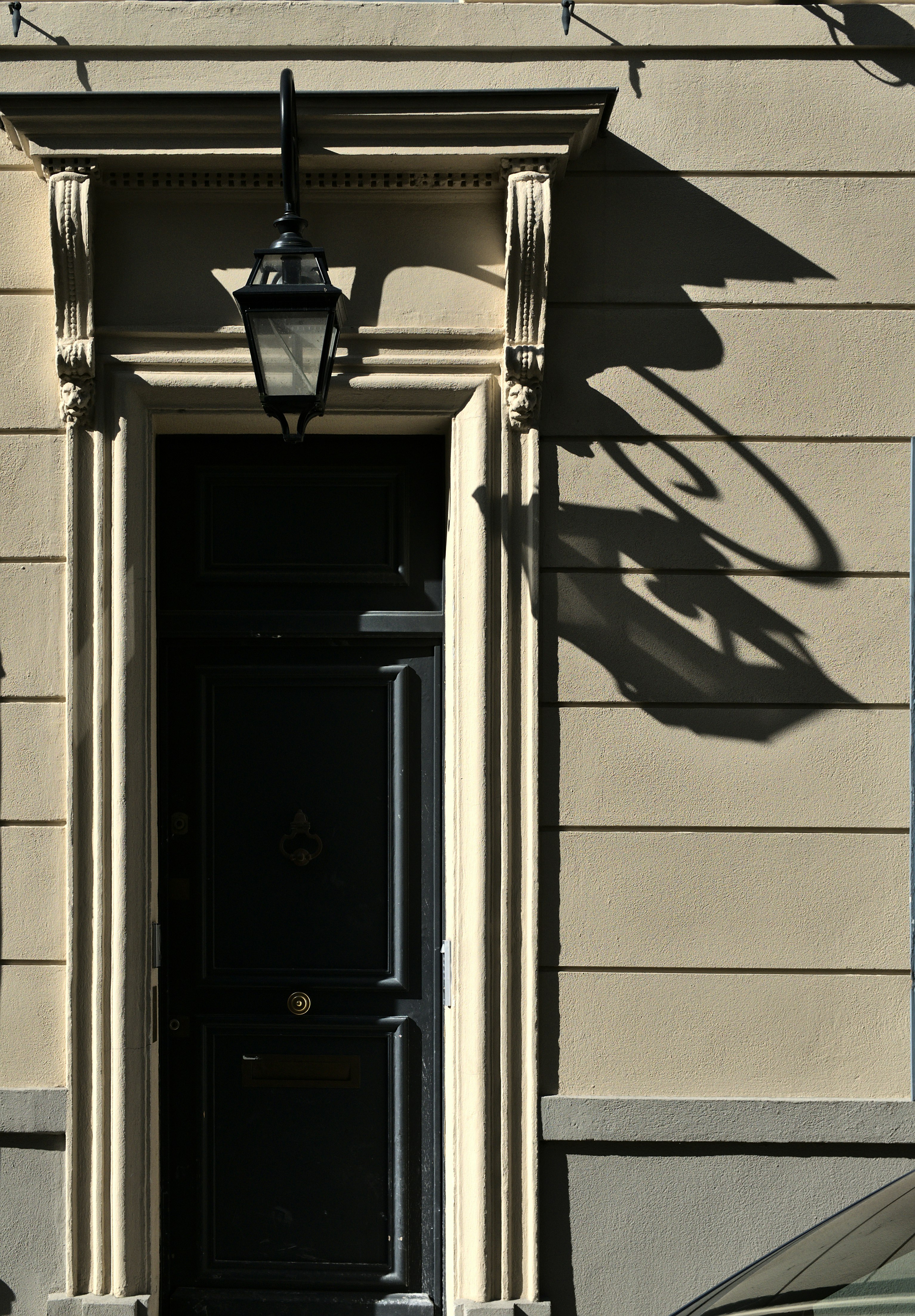 black wooden door with black steel door lever